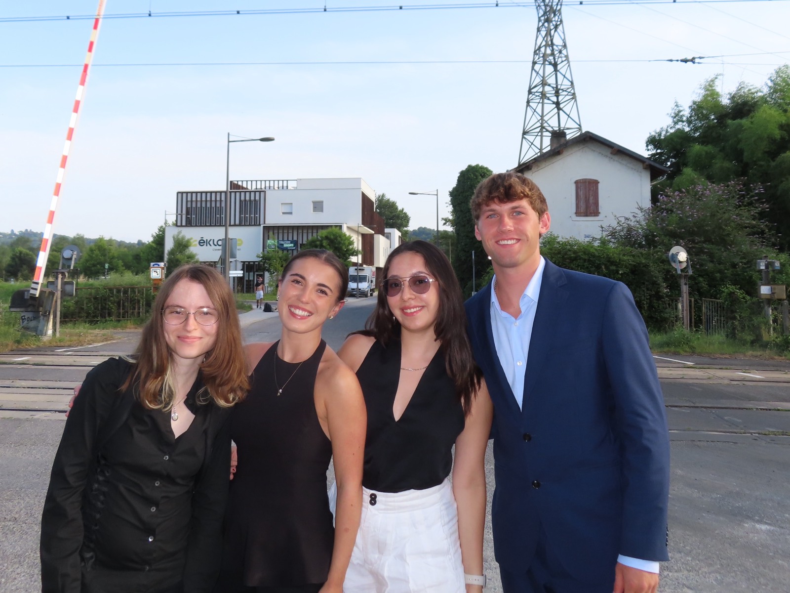 Four members of our research group smiling together outdoors in France